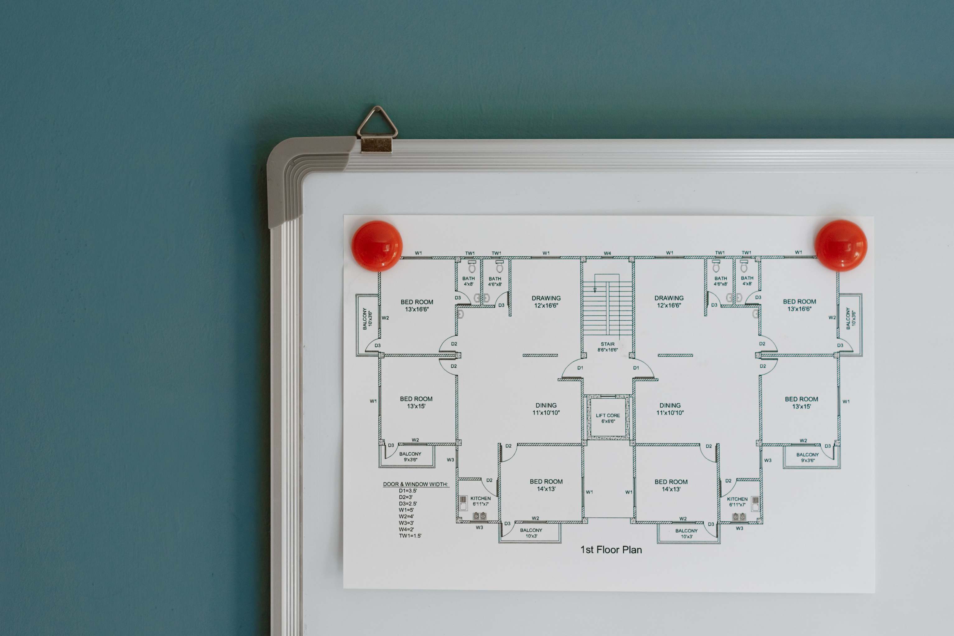 Interior view of a whiteboard with software planning diagrams — architecture notes and flowchart sketches
